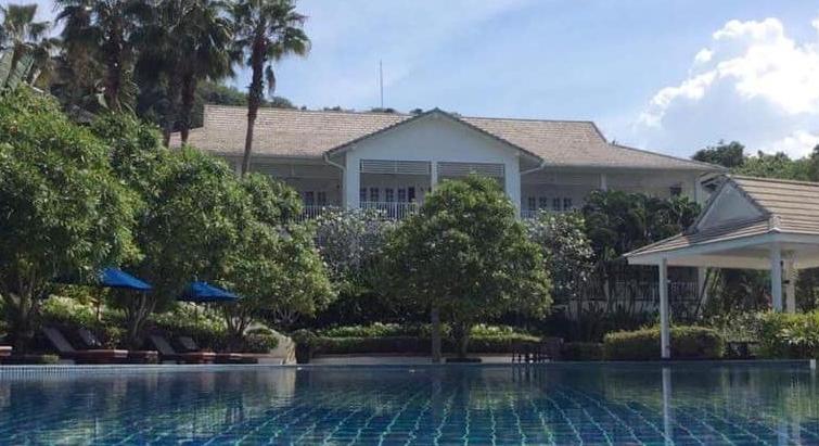 A sunbathing terrace, an outdoor swimming pool