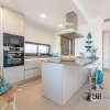 New villas. Very chic. Very high quality. And on foot at the port and on the beach.