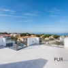 New villas. Very chic. Very high quality. And on foot at the port and on the beach.