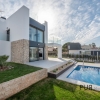 New villas. Very chic. Very high quality. And on foot at the port and on the beach.