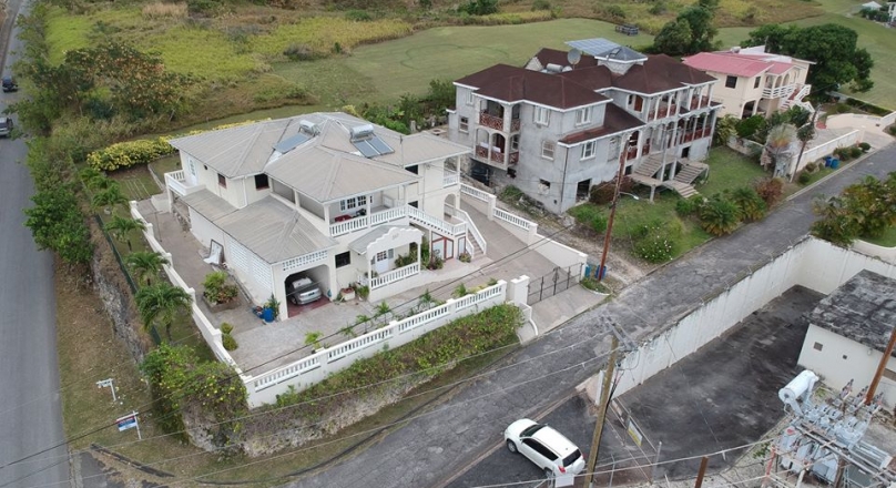 6 Bed 4 Bath centrally located property with 2 Apts in St. George, Barbados is for sale.